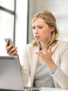 picture of confused woman with cell phone